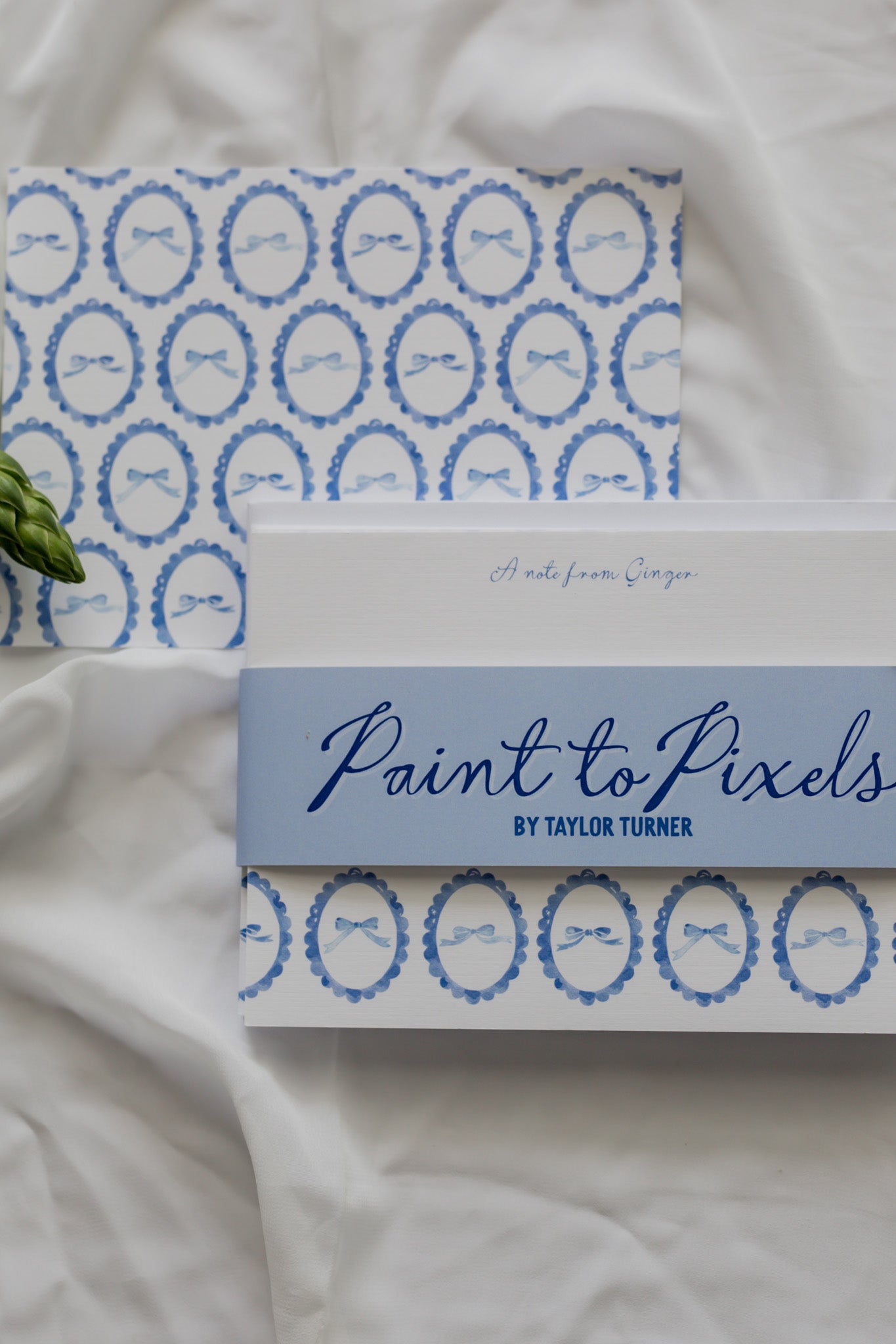 Bow stationery set with Paint to Pixels packaging on white background