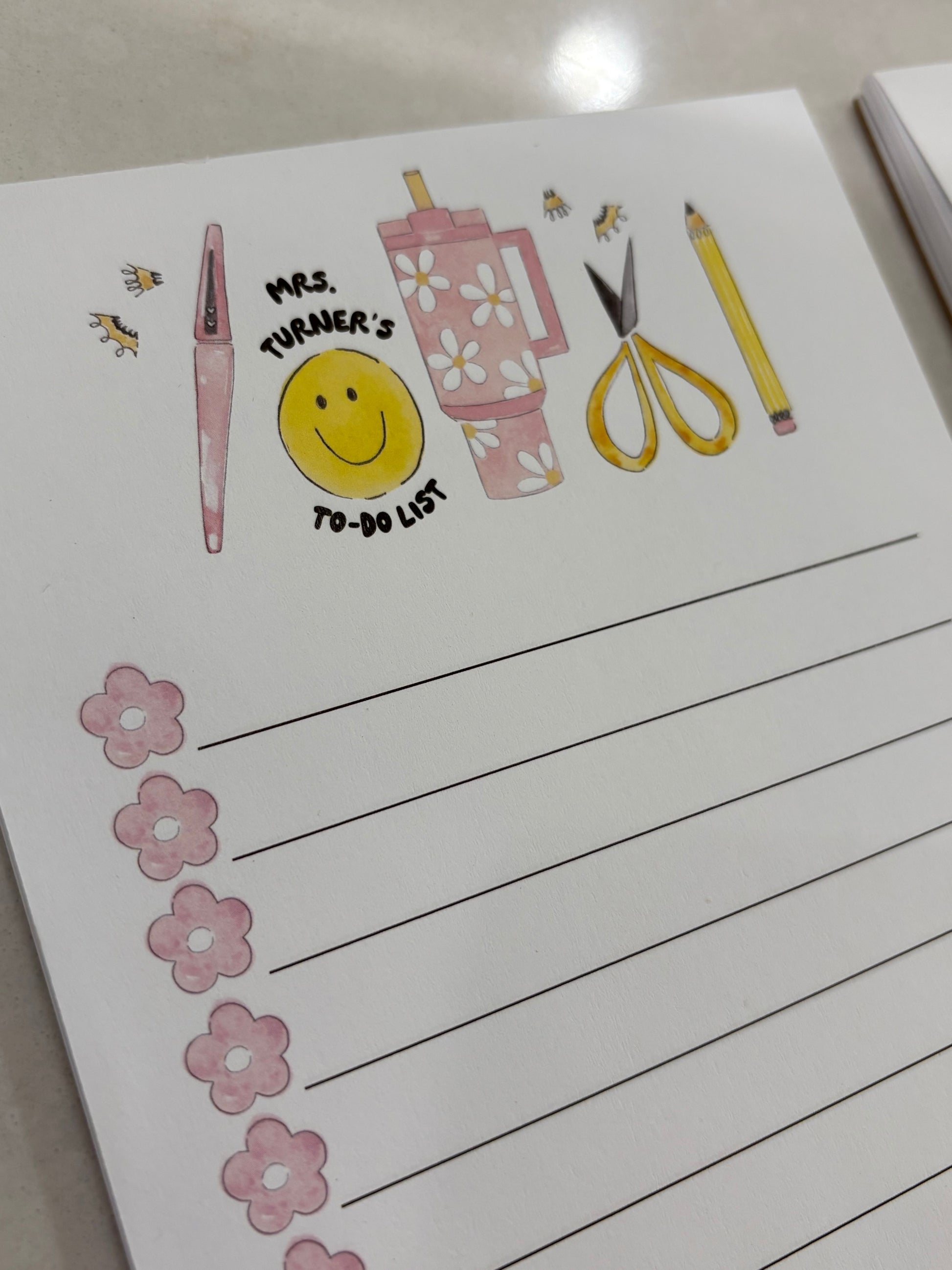 Notebook with illustrations and text on a white surface