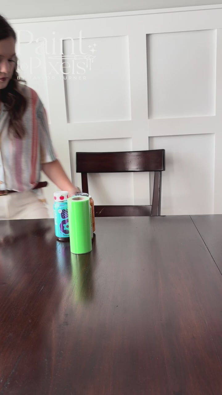 tutorial on how to use the teacher appreciation tag. Using 3 soda cans, ribbon, and tags. Woman sitting at a brown table with a white background